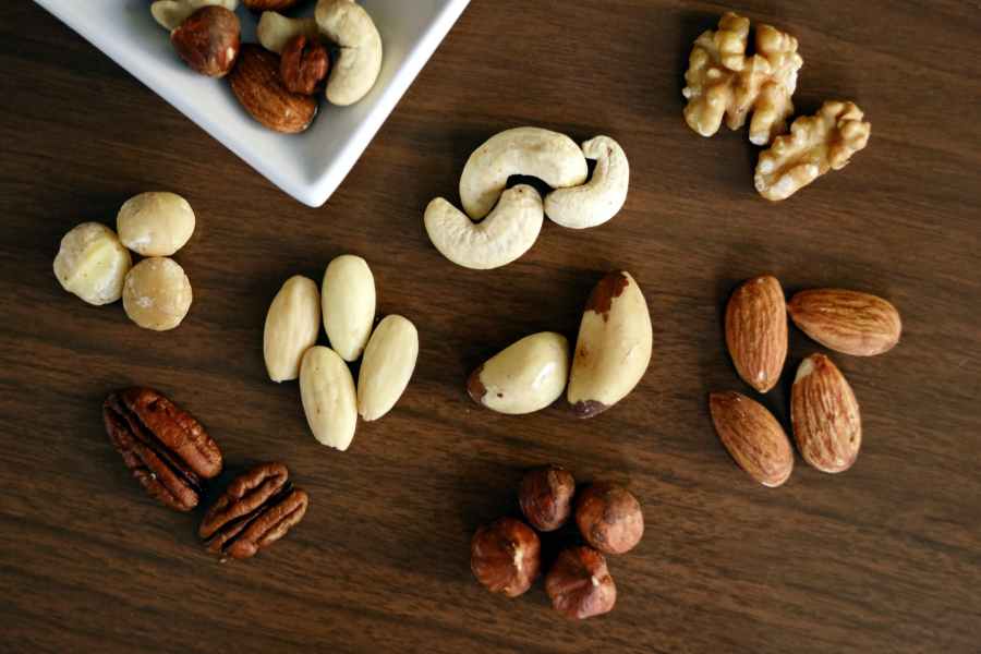 10 Healthy Foods to Lose Weight 9 variety of brown nuts on brown wooden panel high angle photo