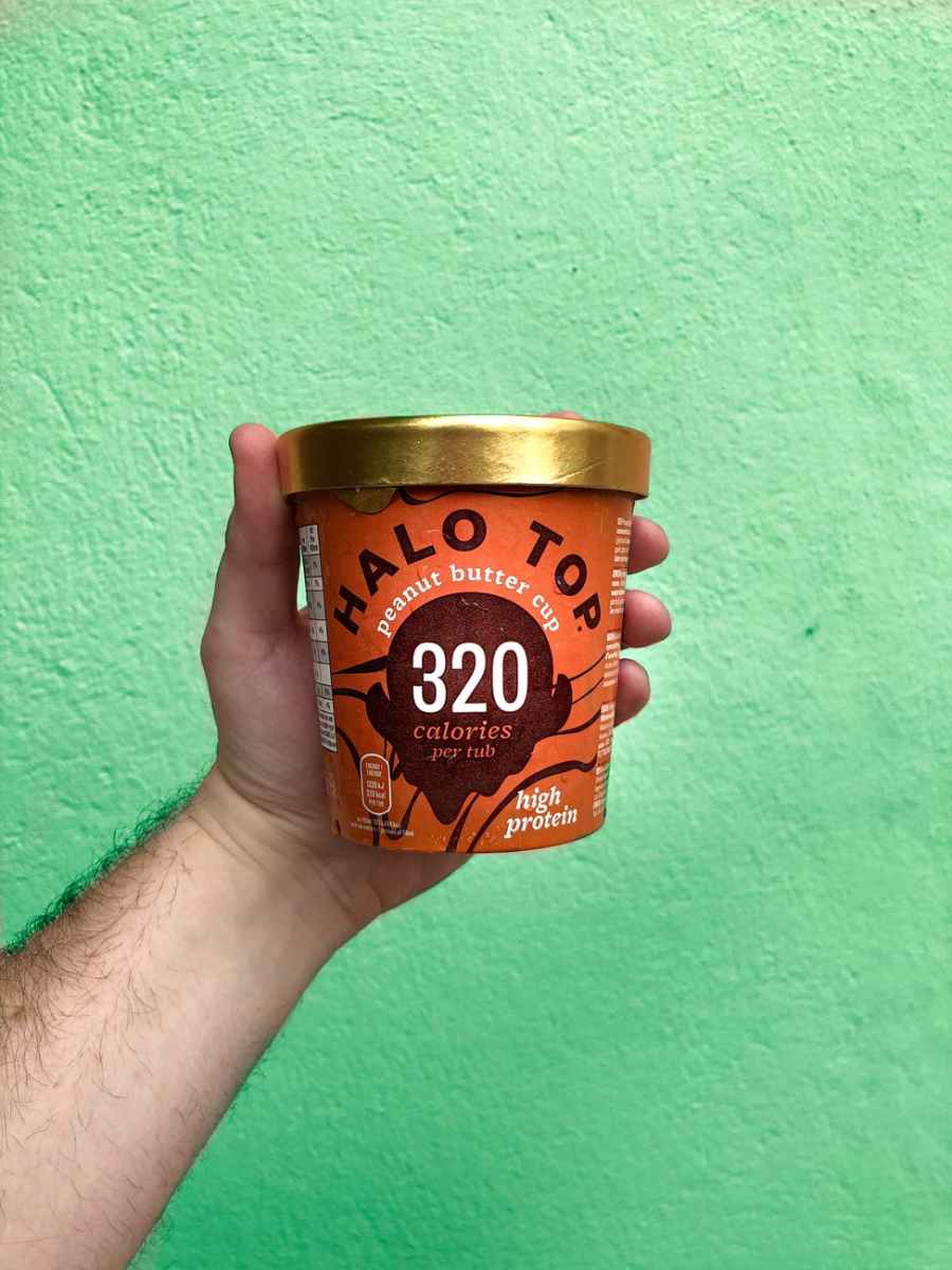 10 Healthy Foods to Lose Weight 6 man holding cup of peanut butter